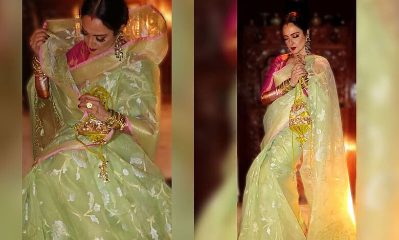 Rekha exudes timeless elegance in a handwoven Banarasi Kora silk saree