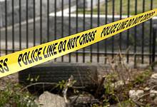 Yellow police tape reading 'Police Line Do Not Cross' at an accident scene - represents investigation into fatal hit-and-run involving Indian student in US.