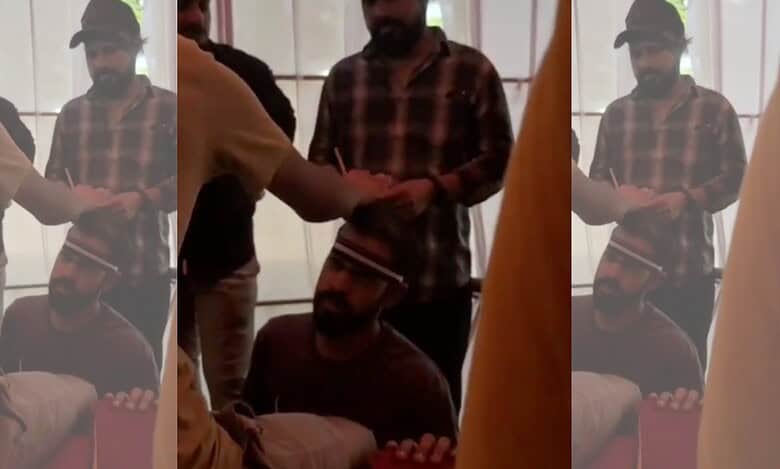 An Instagram Influencer applying hair oil on a customers head