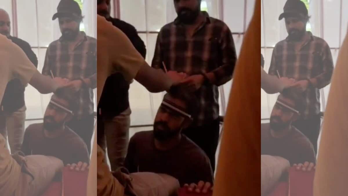 An Instagram Influencer applying hair oil on a customers head