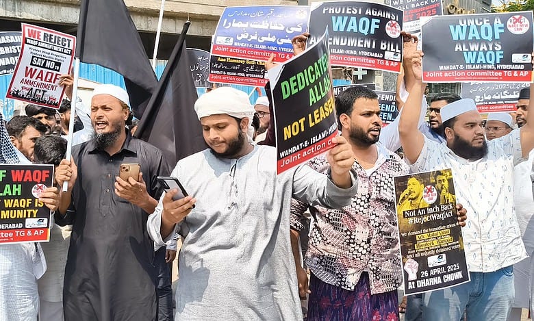 Protesters holding anti-Waqf Act placards at Saidabad