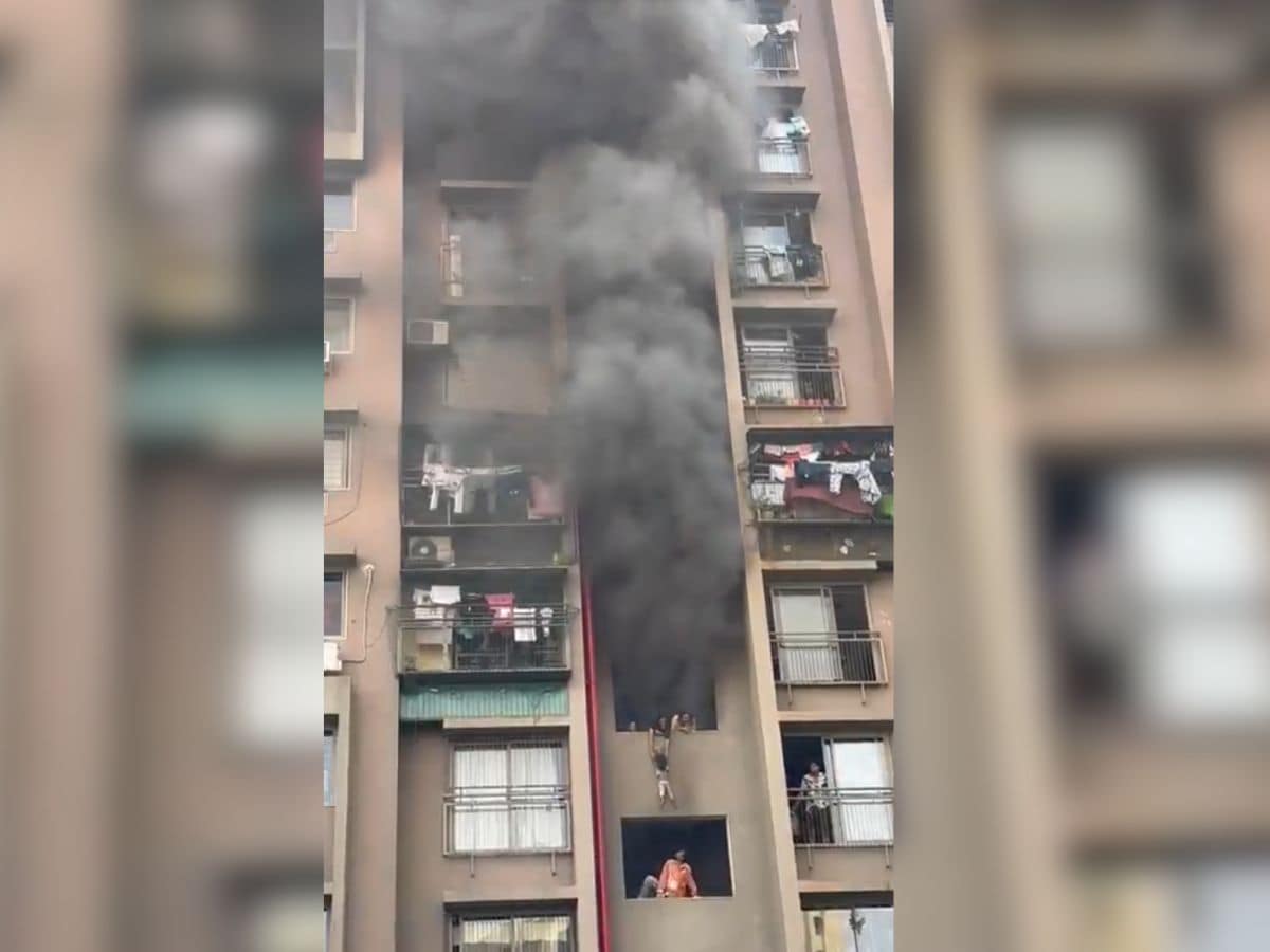 Woman dangles child from balcony as fire engulfs Ahmedabad building