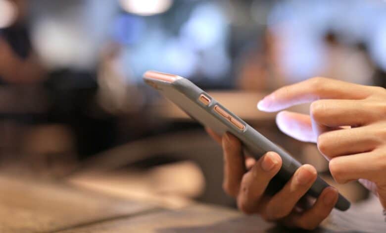 A representational image of person holding a phone