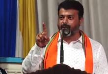 The image displays a picture of BJP MLA of Belthangady, Harish Poonja speaking at a religious ceremony at the Gopalakrishna Temple in Thekkaru village, Dakshina Kannada district.