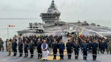 In this handout image released on May 30, 2025, Union Defence Minister Rajnath Singh with Chief of the Naval Staff (CNS) Admiral Dinesh K Tripathi and others aboard aircraft carrier INS Vikrant. (Handout via PTI Photo)