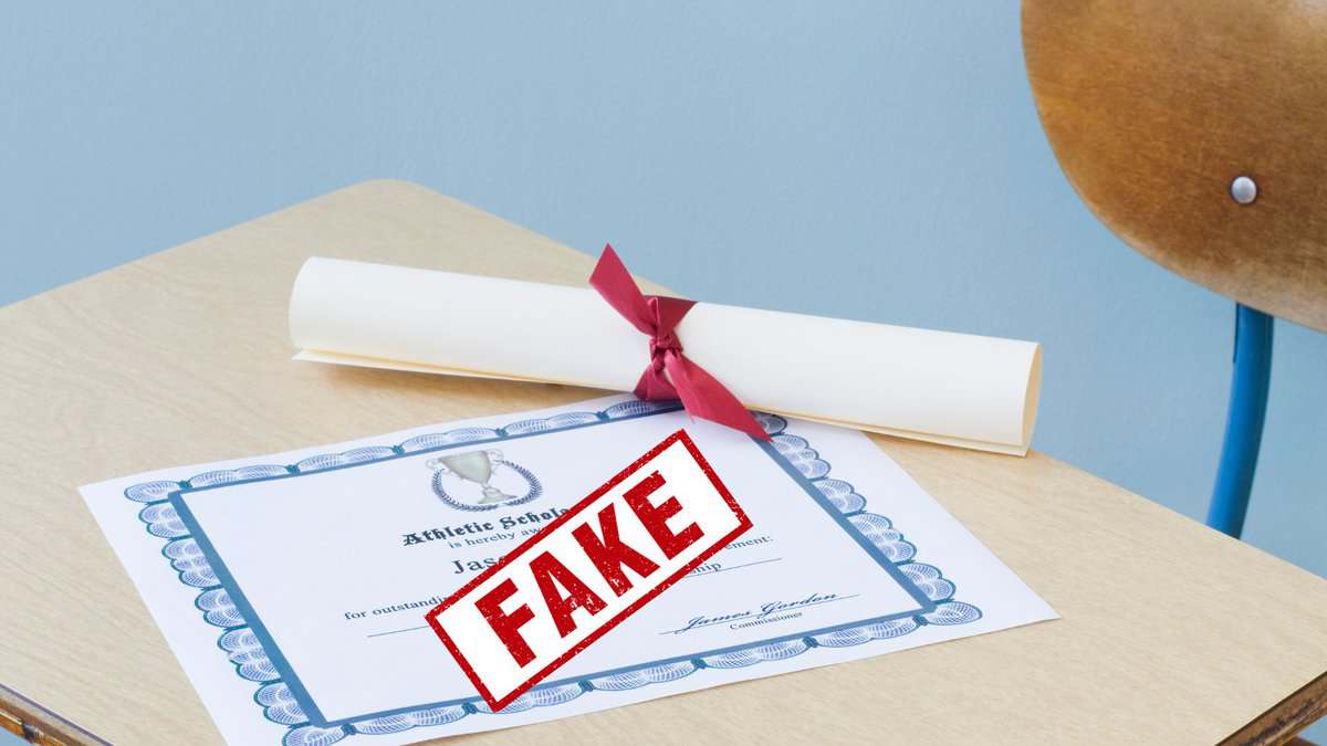Representational Image of a diploma placed on a table with a fake stamp