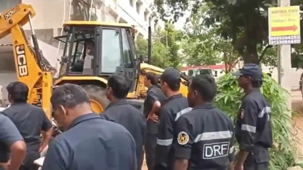 HYDRAA officials clearing illegal road encroachments in a residential area of Hyderabad after receiving complaints from local residents.