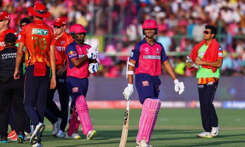 Rajasthan Royals and Punjab Kings players greet each other after an IPL 2025 match, with RR batters walking off the field