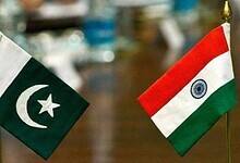 Flags of Pakistan and India placed side by side during bilateral peace talks, symbolising the recent ceasefire agreement.
