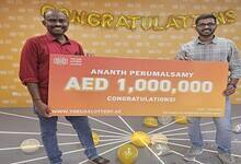 Ananth Perumalsamy, receives the prize money after winning the UAE Lottery