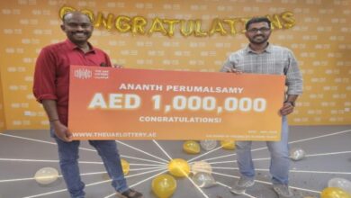 Ananth Perumalsamy, receives the prize money after winning the UAE Lottery