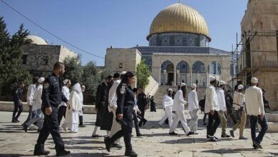 Israeli settlers escorted by police walk through Al Aqsa Mosque compound in occupied East Jerusalem.