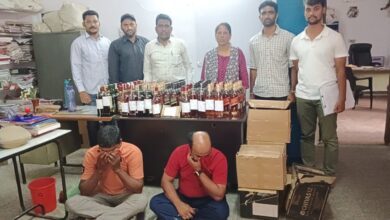 Officials of the prohibition and excise department in Hyderabad display seized.