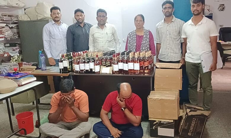 Officials of the prohibition and excise department in Hyderabad display seized.