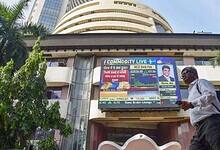 Mumbai: A man walks past the Bombay Stock Exchange (BSE) building, in Mumbai, Tuesday, Dec. 5, 2023. Sensex on Tuesday jumped 169.94 points to fresh peak of 69,035.06 in early trade; Nifty climbed 52.60 points to hit record high of 20,739.40. (PTI Photo)