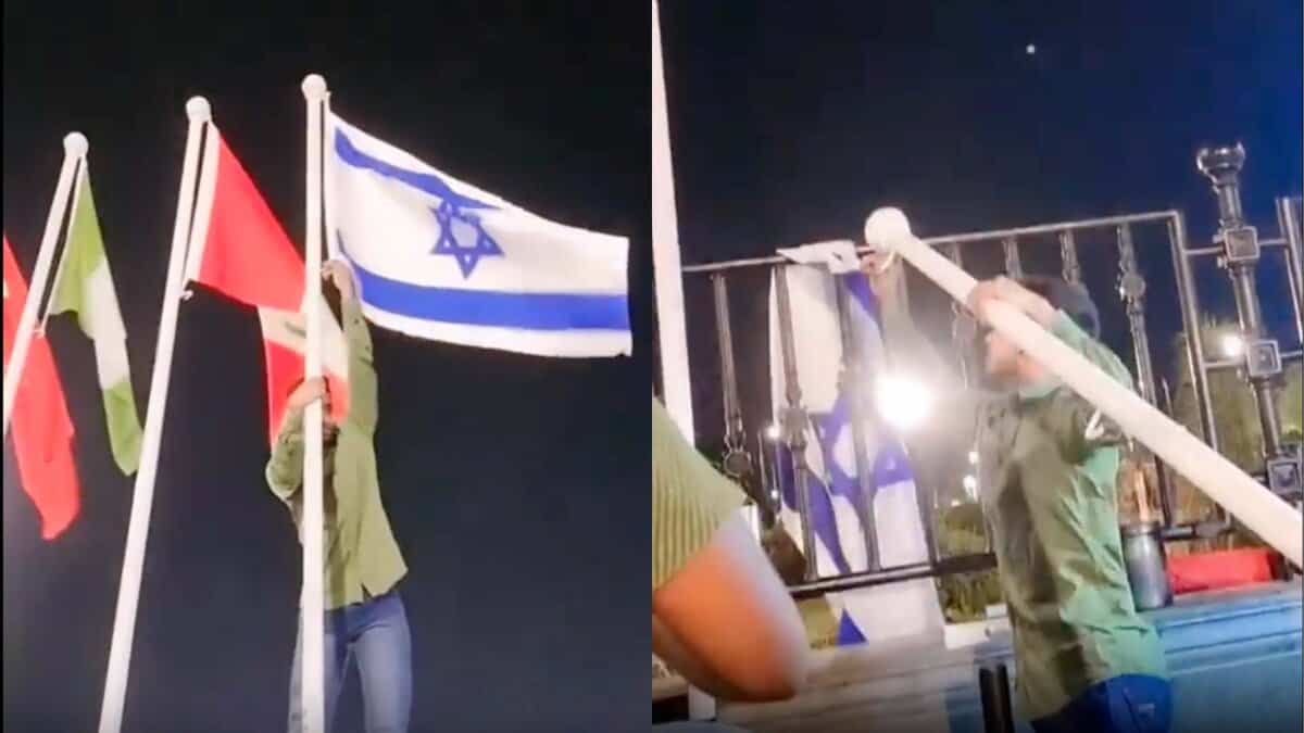 A man removes Israeli flag from the Telangana Secretariat
