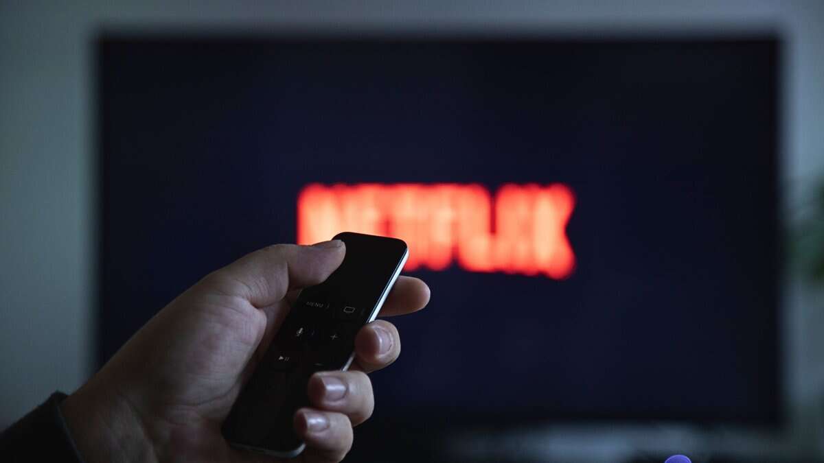 Someone switching on the TV to watch Netflix for ban on Pakistani content on OTT platforms