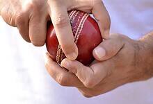 Representational Image of man holding cricket ball