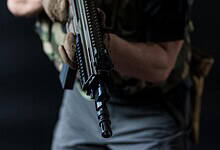 Representational Image of man holding a gun