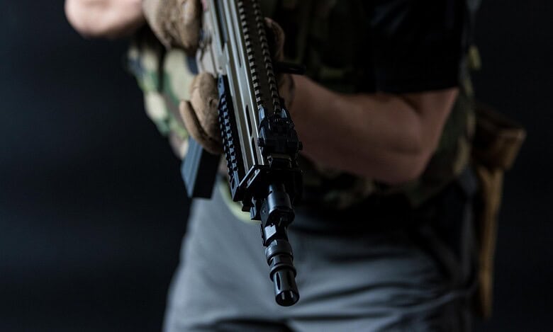 Representational Image of man holding a gun