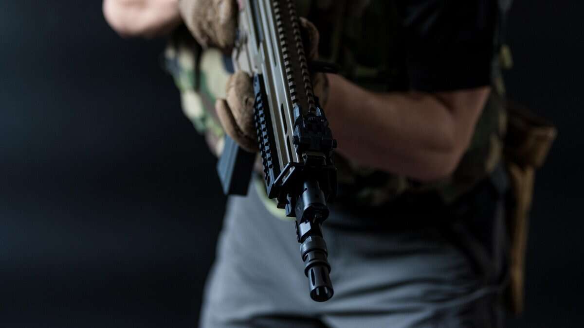 Representational Image of man holding a gun