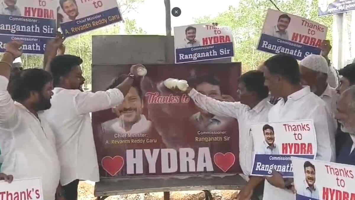 Residents of Firzadiguda pour milk on pictures of Telangana chief minister Revanth Reddy and HYDRAA commissioner AV Ranganath to celebrate HYDRAA’s removal of encroachments from cemetery land.