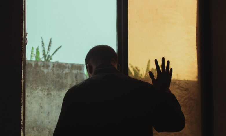 Man standing near window