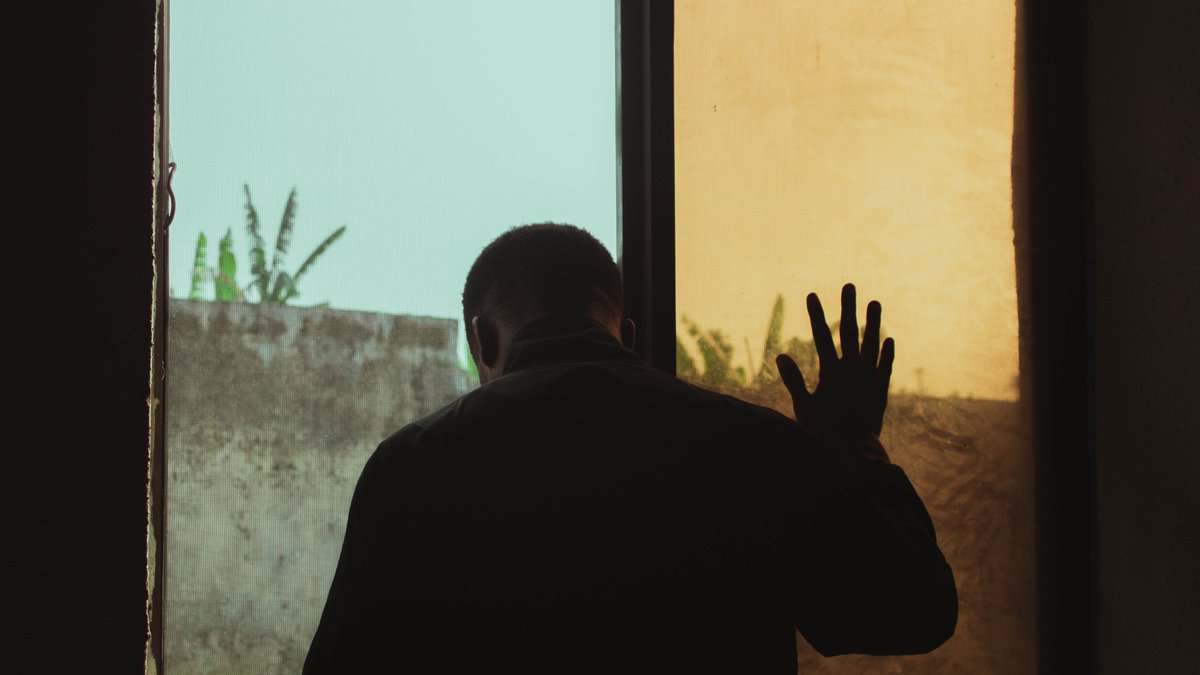 Man standing near window