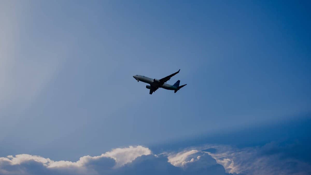 Representative image of airplane flying under blue sky