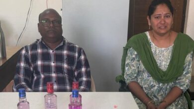 Two government officials, a man and a woman seated after being caught red-handed by ACB for accepting bribe