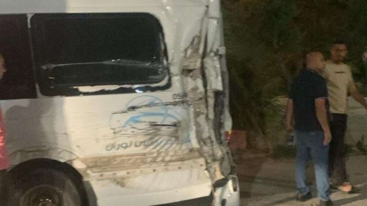 The image display a picture of a crushed van carrying Palestinian Haj pilgrims