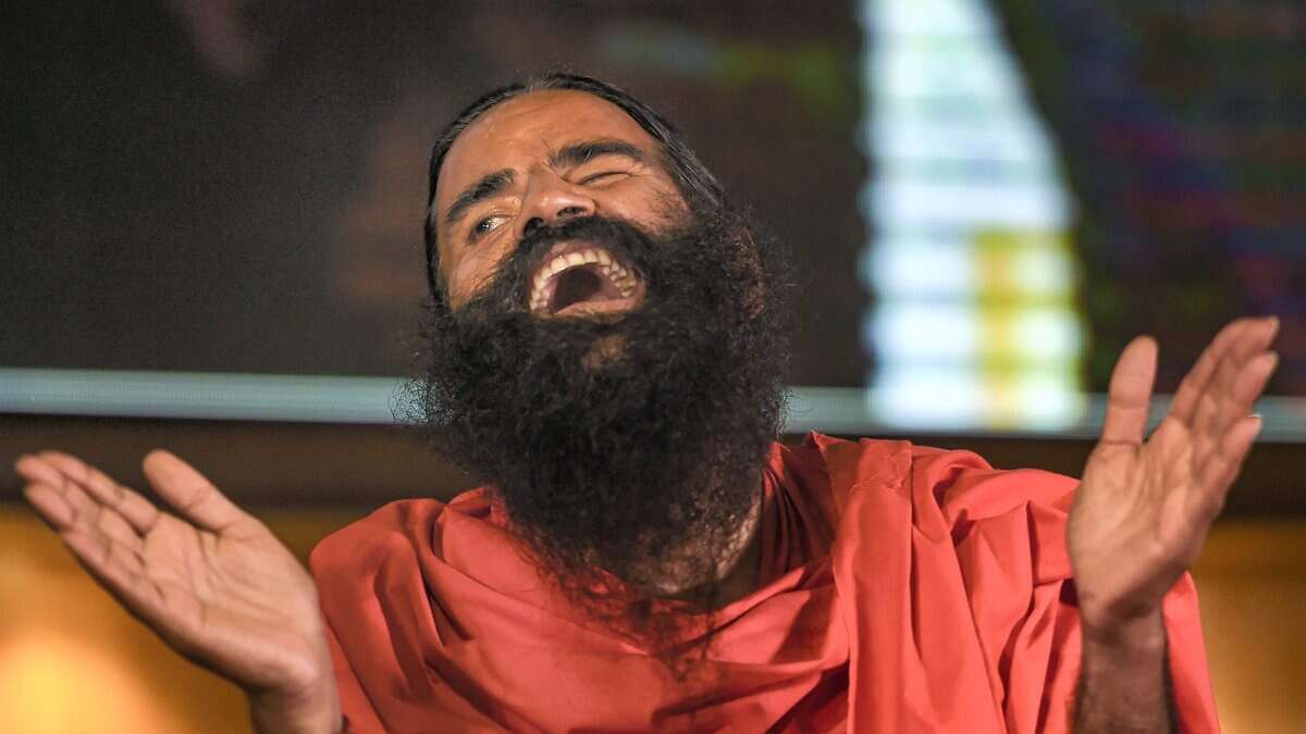 The image displays a picture of Baba Ramdev
