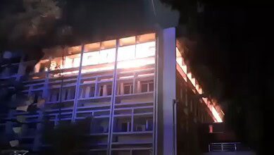 The image displays a building caught in a fire accident in Secunderabad on Sunday