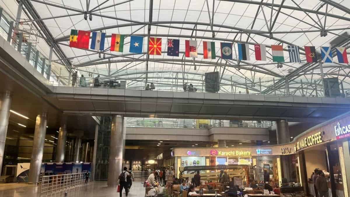 Flags of countries to be represented at Miss World 2025 are displayed at Hyderabad Airport ahead of the pageant