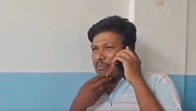 A man speaks to the police on the phone after the stillbirth of his twin children in Ibrahimpatnam on Sunday, May 4