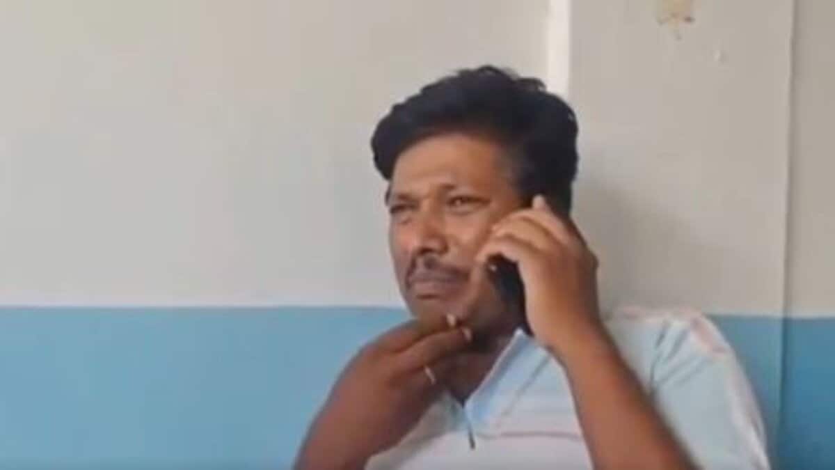 A man speaks to the police on the phone after the stillbirth of his twin children in Ibrahimpatnam on Sunday, May 4