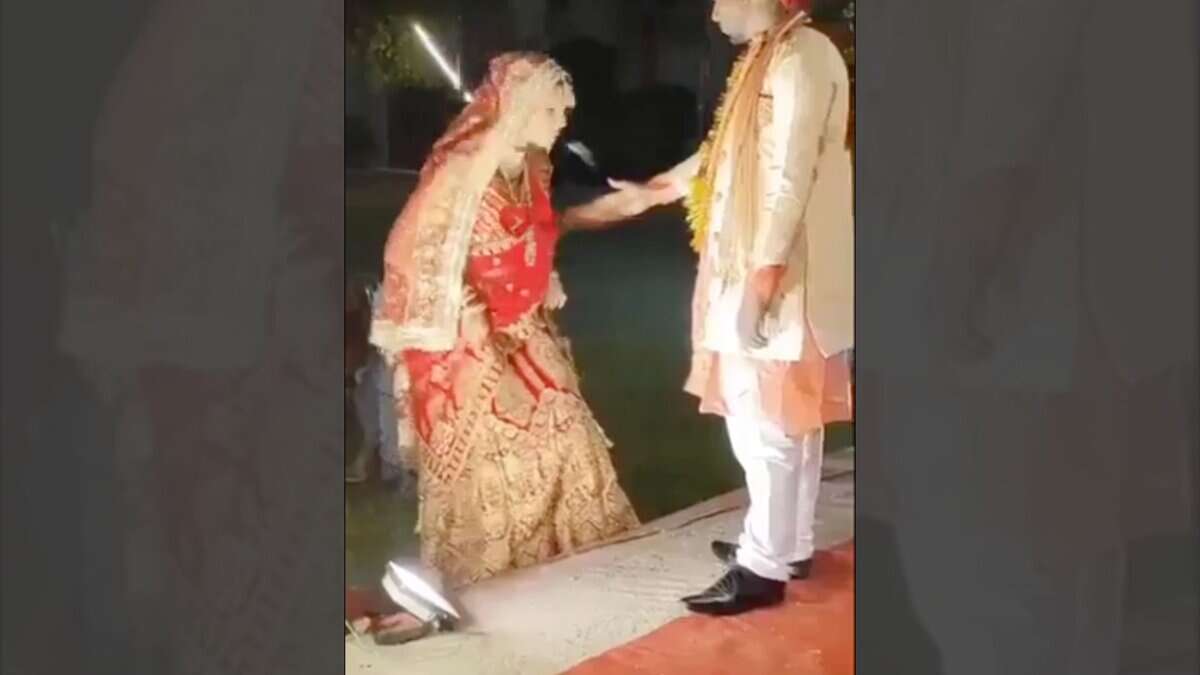 Bride spits on bridegrooms hand