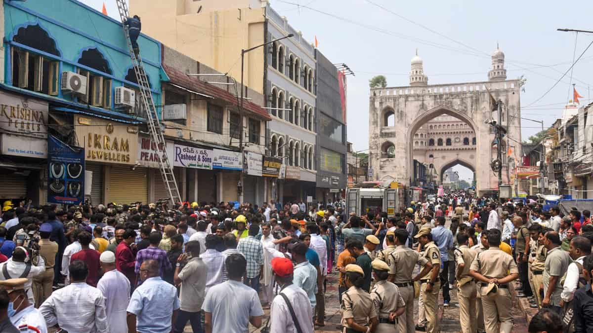 The image shows firefighters carrying out rescue and relief work after a fire broke out in a building near Gulzar Houz in the Old City area of Hyderabad on Sunday