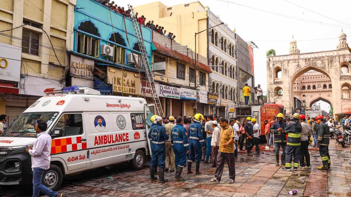 The image shows firefighters carrying out rescue and relief work after a fire broke out in a building near Gulzar Houz in the Old City area of Hyderabad on Sunday