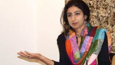 The image displays a picture of professor Nitasha Kaul
