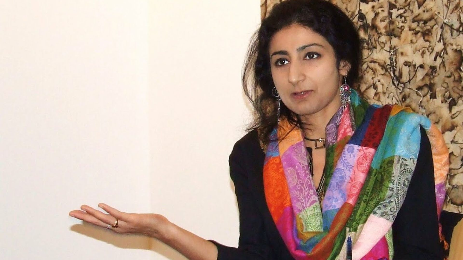 The image displays a picture of professor Nitasha Kaul