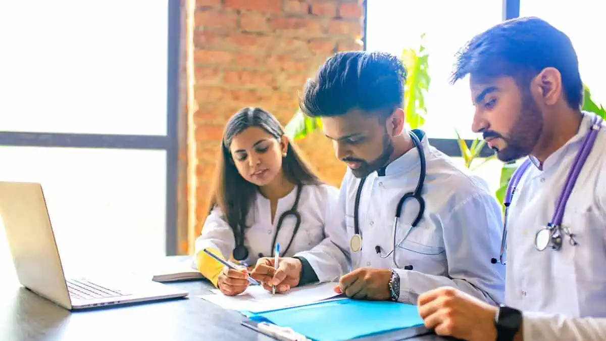 The image displays a picture of medical students