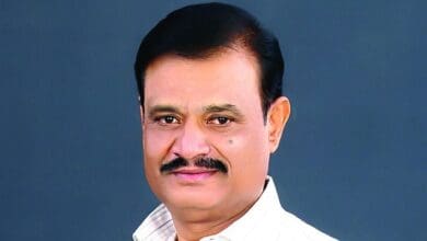 The image displays a picture of Karnataka BJP MLA Munirathna