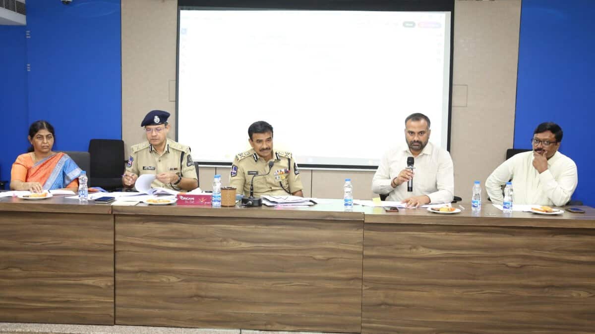 The image displays a picture of Hyderabad city police commissioner CV Anand, along with GHMC commissioner RV Karnan, at a preparedness meeting with officials for the upcoming Bakrid festival