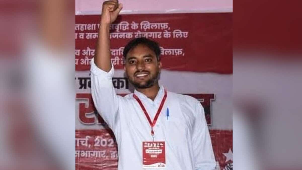 The image displays a picture of a Dalit PhD scholar Manish Kumar