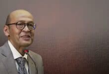 The image displays a picture of Justice Yashwant Varma