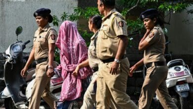 Police personnel produce Sunita Jamgade, a nurse who was repatriated by Pakistani authorities through the Attari-Wagah border on Saturday