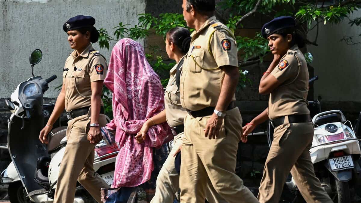 Police personnel produce Sunita Jamgade, a nurse who was repatriated by Pakistani authorities through the Attari-Wagah border on Saturday
