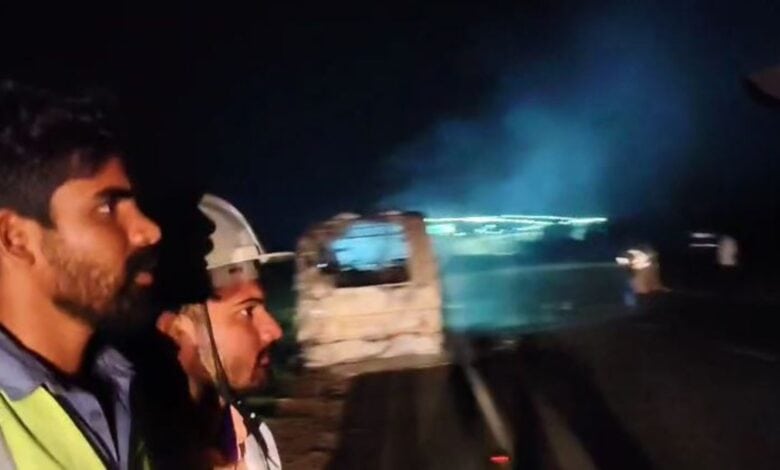 Fire fighters arrive on the Suryapet- Khammam Highway where the bus caught fire