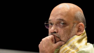 The image displays a picture of Union Home Minister Amit Shah